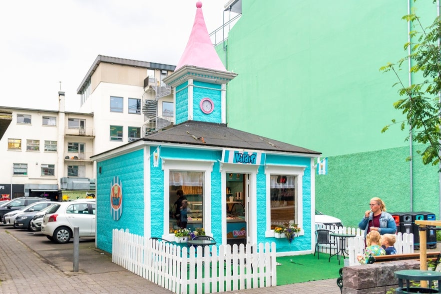 Icelander woman with children outside Valdis Ice Cream Shop in Reykjavik, Iceland.