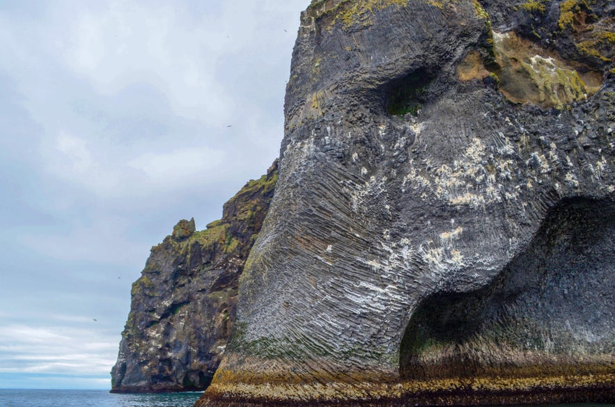 Close-up view of Elephant Rock, the elephant-shaped basalt sea cliff on Heimaey Island in the Westman Islands, Iceland.