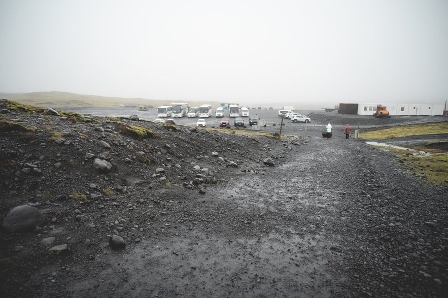 Parking lot near Solheimajokull Glacier in South Iceland, where visitors begin the short walk to the glacier hiking area.