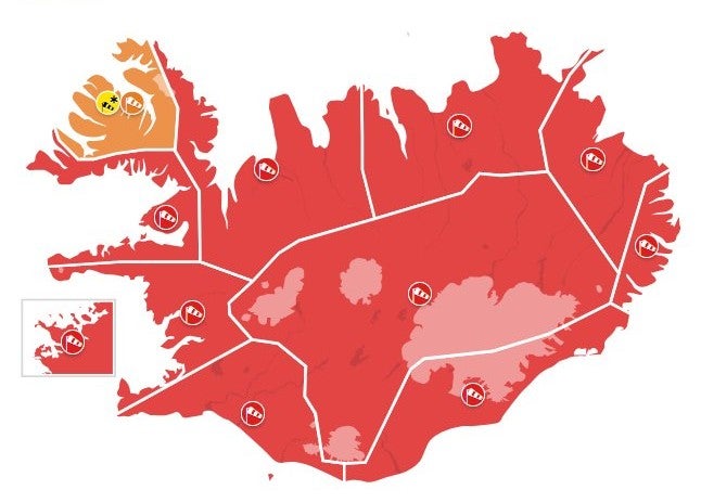 Map of Iceland highlighting areas with a red alert weather warning for severe conditions.