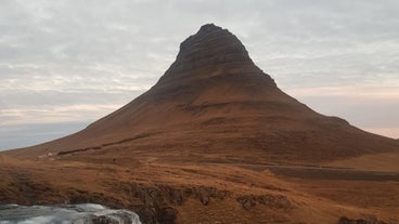 The iconic Kirkjufell Mountain is one of the most photographed landmarks in Iceland, drawing visitors from around the world to its striking beauty.