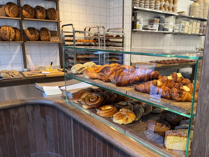 Fresh croissants, cinnamon rolls, and pastries on display inside 280 Bakery, an artisan bakery in downtown Reykjavík