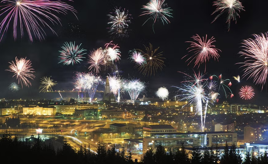 Fireworks burs over the night sky on New Year's Eve, one of the best things to do see in Reykjavik in January