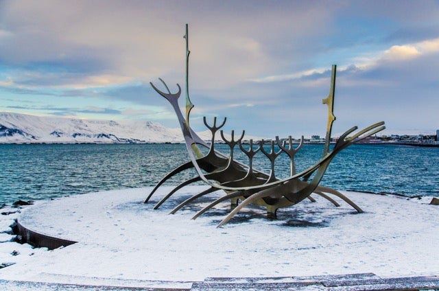 The Sun Voyager sculpture sits on a patch of ice on a winter day in Reykjavik in January.