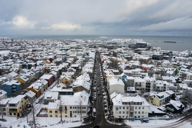 Overhead view of the snow-dusted town of Reykjavik. 