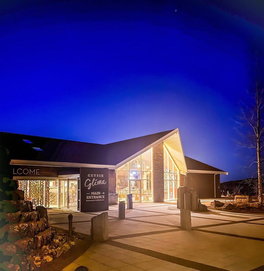 Night view of the winery entrance at Geysir Glíma Restaurant, featuring soft lighting and inviting ambiance.