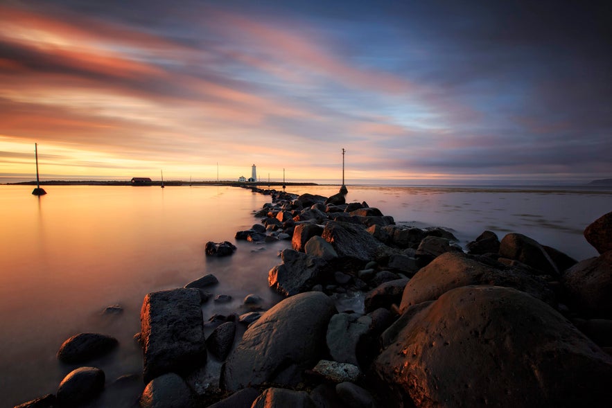 Grotta Nature Reserve bathed in the golden glow of the midnight sun near Reykjavik.