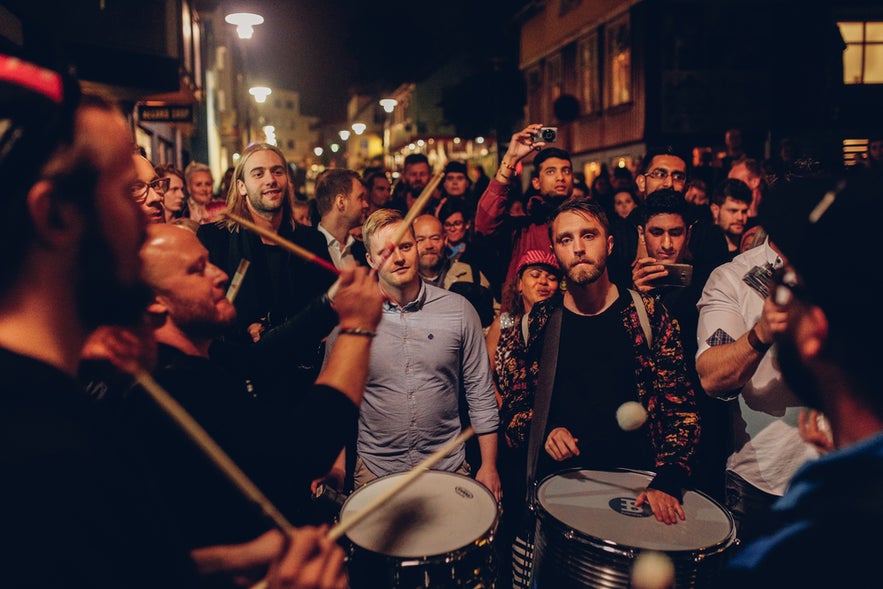 Street festival in Reykjavik with live drums showing why Iceland is worth visiting for vibrant nightlife and culture.
