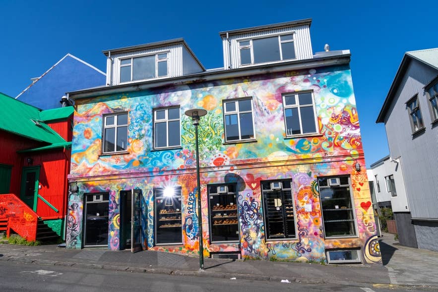 Colorful street art building in Reykjavik showing why Iceland is worth visiting for creative urban culture. Colorful street art building in Reykjavik showing why Iceland is worth visiting for creative urban culture.