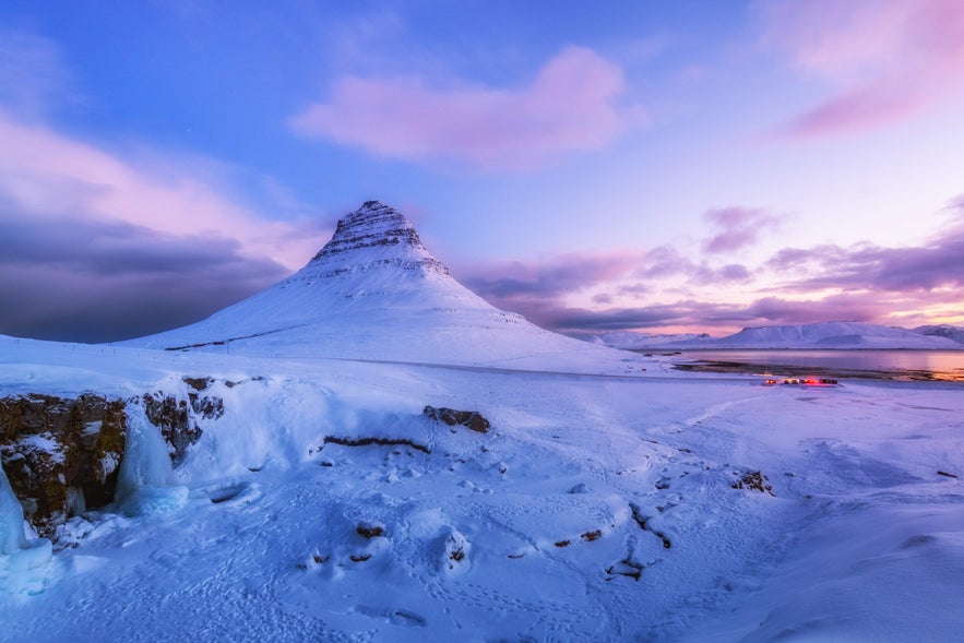 Kirkjufell mountain in winter snow at sunset, a top Iceland February photography location