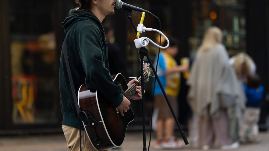 Street musician performing during the Reykjavik Arts Festival, capturing the lively atmosphere of Reykjavik in May