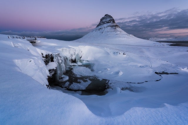 Snow-covered Mt. Kirkjufell, an iconic attraction in the Snaefellsnes Peninsula, Iceland.