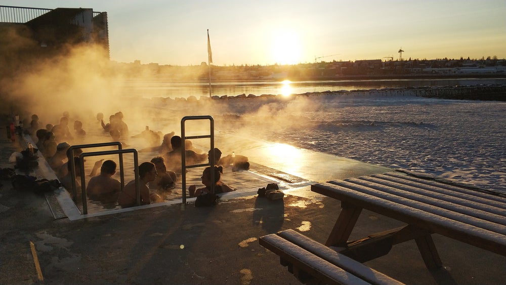 People soak in a hot tub at Nautholsvik Geothermal Beach in Reykjavik. People soak in a hot tub at Nautholsvik Geothermal Beach in Reykjavik.
