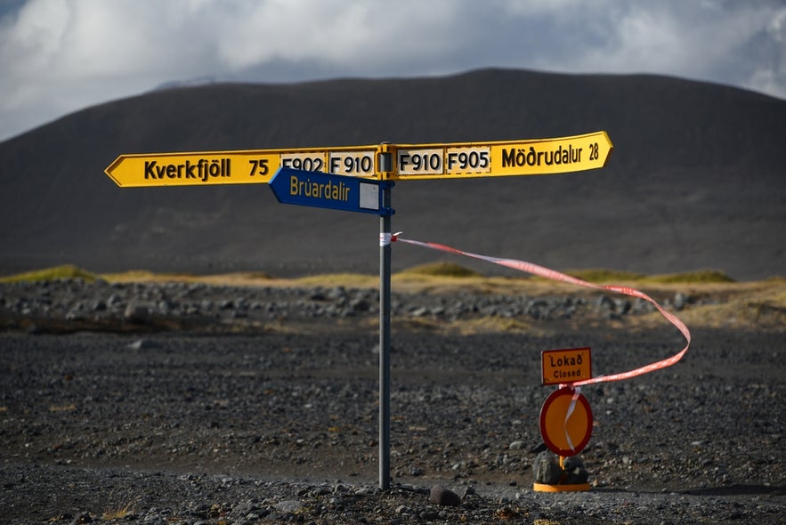 Road signs to Kverkfjoll and Modrudalur with a closed road marker, showing Highland closures in Iceland in April.
