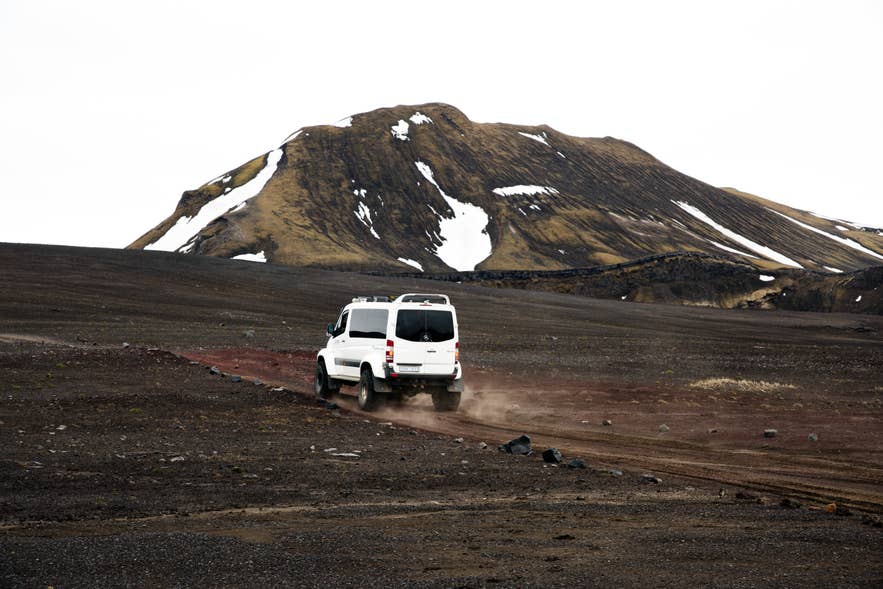 4x4 driving along a gravel F-road in the Icelandic Highlands.