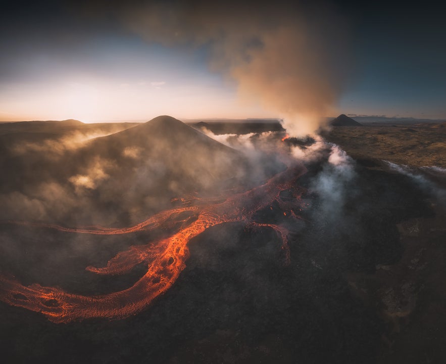 Volcano crater at Litli-Hrutur eruption in 2023 with gas blowing over the mountains on the Reykjanes peninsula in Iceland