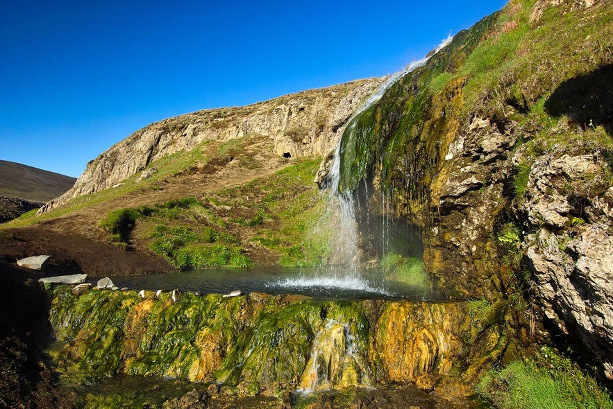 Laugarvellir hot natural waterfall in east Iceland where people can bathe in the summer in unchanged nature