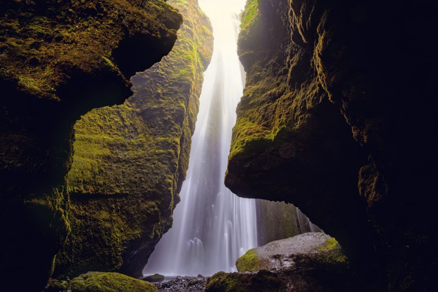 Gljufrabui Waterfall hidden inside a narrow canyon near Seljalandsfoss on Iceland&rsquo;s South Coast, surrounded by mossy cliffs.