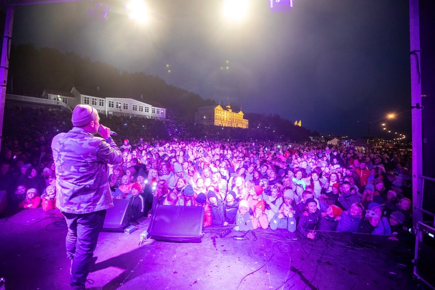 Live performance during Ein Med Ollu in Akureyri, showing the vibrant spirit of summer festivals in Iceland.
