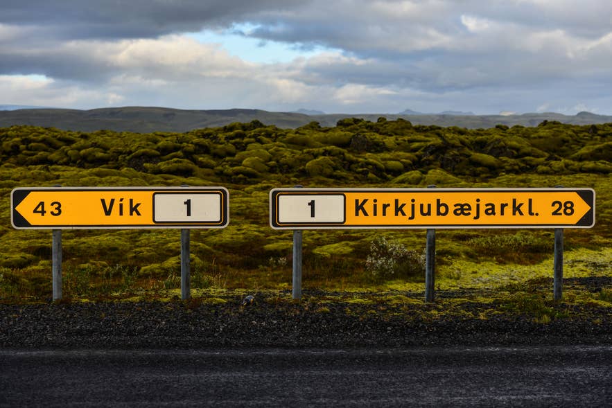Icelandic road sign showing directions to Vík and Kirkjubaejarklaustur, featuring the Icelandic alphabet