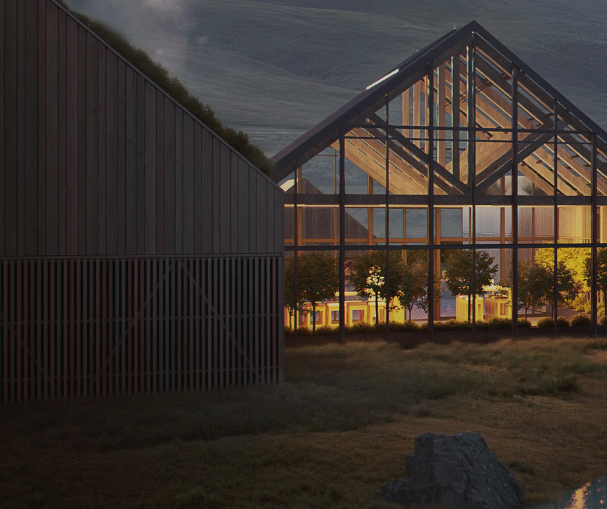 A warmly lit glass-walled building inside Reykjabod Hot Springs in South Iceland.