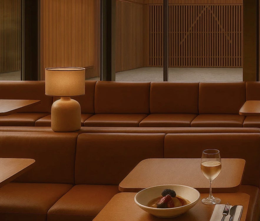 A cushioned couch inside the bistro at Reykjabod Hot Springs.