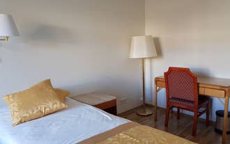 Standard guest room at Hotel Bjarkalundur featuring twin beds.