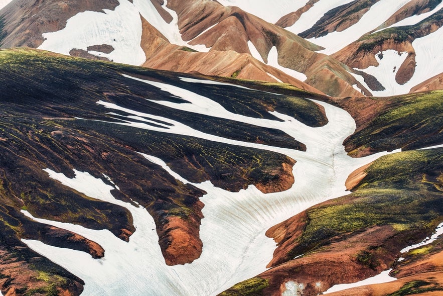 Snow powder on dips and ridges at Landamannalaugar, Icelandic Highlands