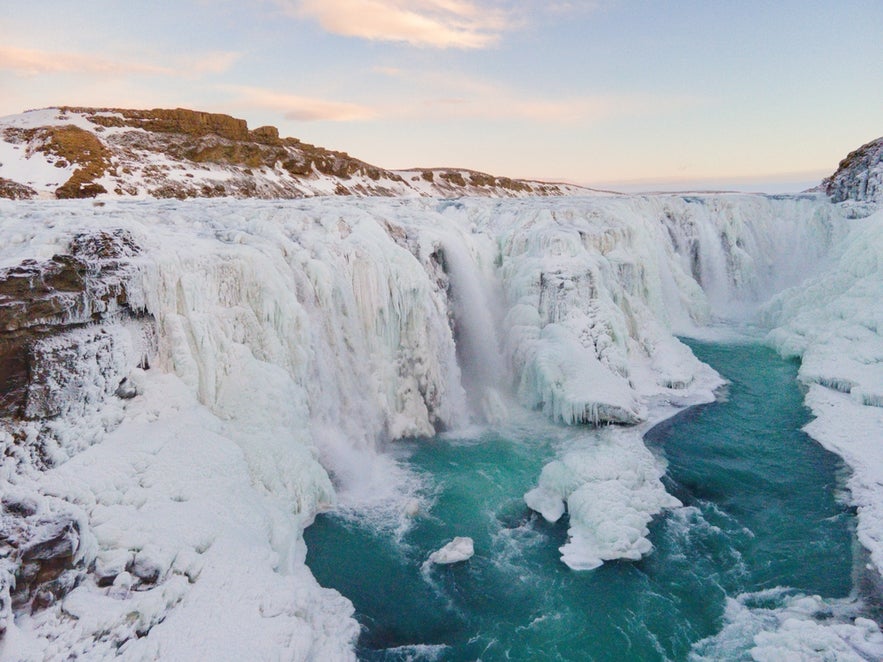 Snow and ice run down Gullfoss Falls, Iceland