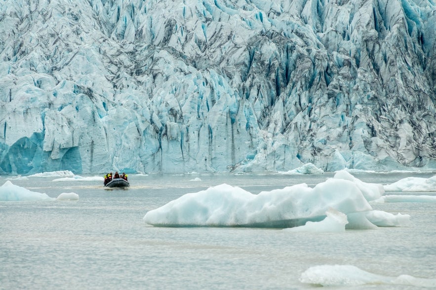 Zodiac boat among icebergs in Fjallsarlon Glacier Lagoon.