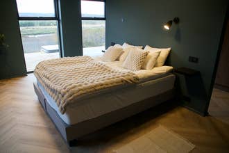 Private bedroom at Golden Circle Luxury Villa designed for families and groups.
