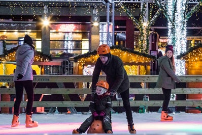 A skating rink in Reykjavik surrounded by Christmas decorations.