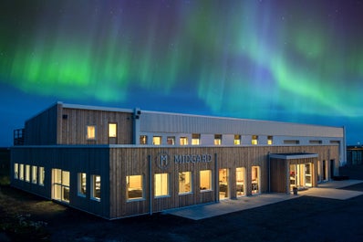 The northern lights appear in the sky above Midgard Base Camp in South Iceland.