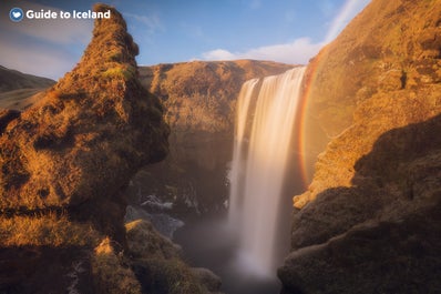 Rainbows are common sights around the Skogafoss waterfall on a sunny day.