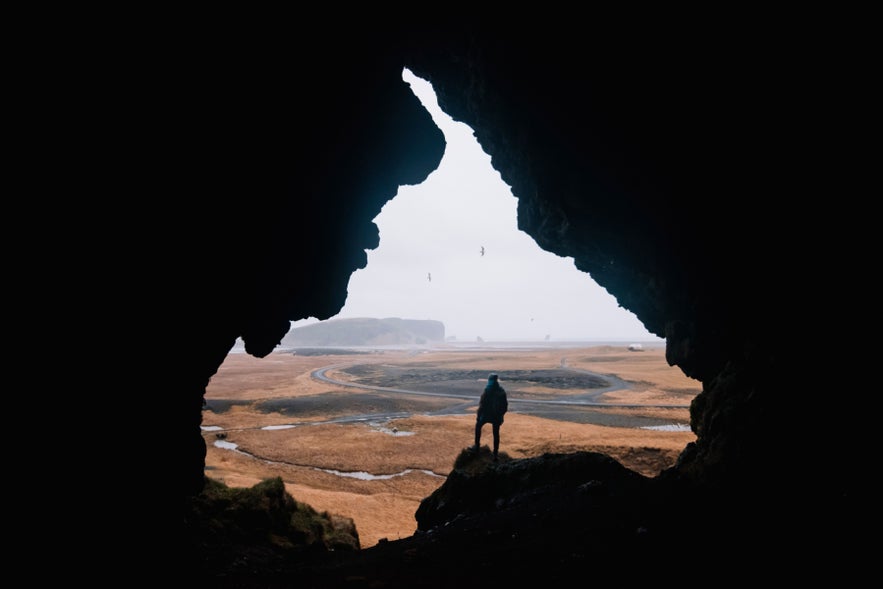 Yoda Cave Gigjagja near Hjorleifshofdi in South Iceland, dramatic cave opening showcasing caves in Iceland.