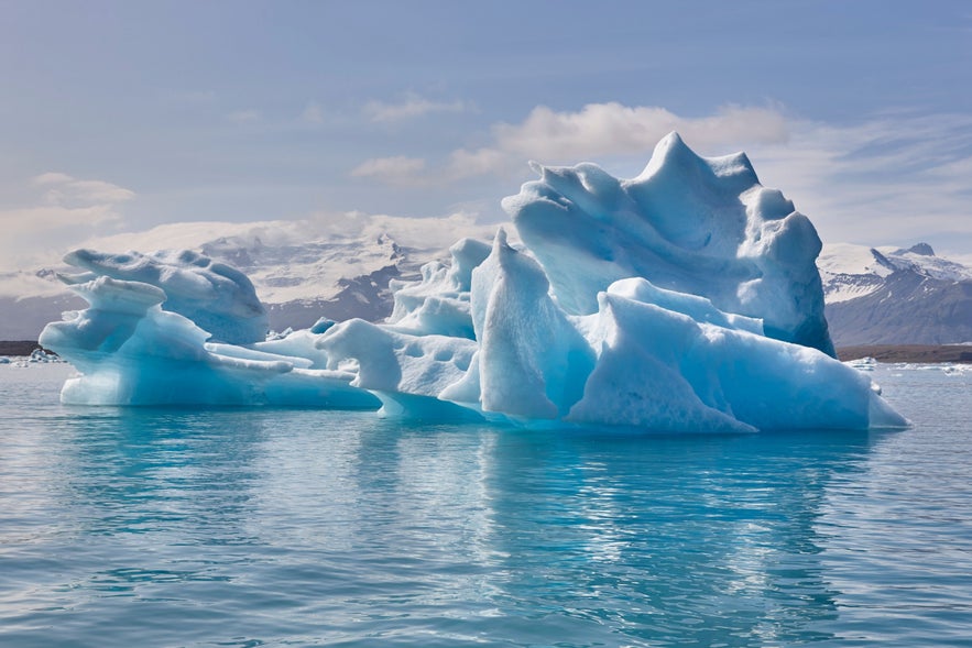 Blue iceberg floating at Fjallsarlon Glacier Lagoon.