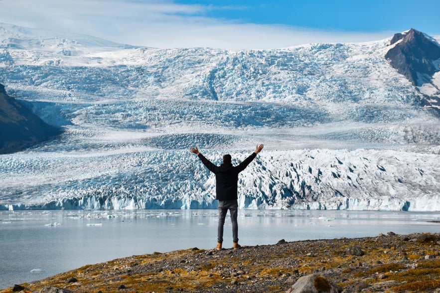 Person overlooking Fjallsarlon Glacier Lagoon.