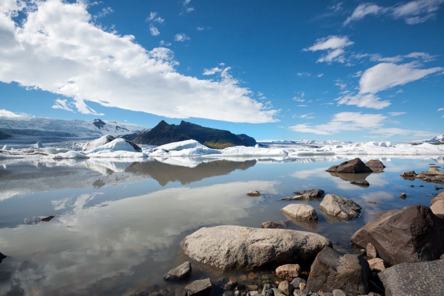 Blue sky reflected at Fjallsarlon Glacier Lagoon.
