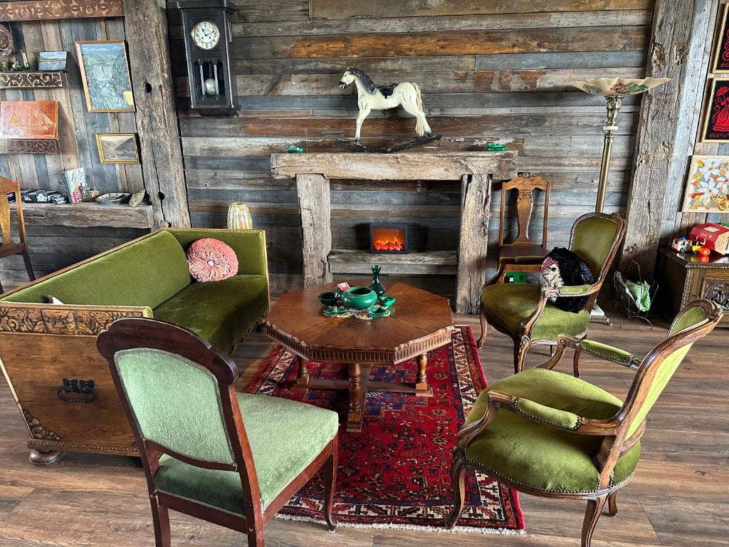 Curl up in a cozy nook by the fireplace, surrounded by the charm and character of our lovely country cottage.