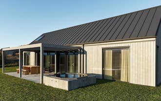 Heidin Homes Villas exterior showing private patios, contemporary architecture, and open scenic views in North Iceland.
