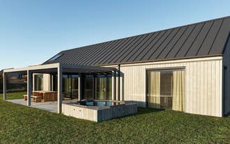 Heidin Homes Villas exterior showing private patios, contemporary architecture, and open scenic views in North Iceland.