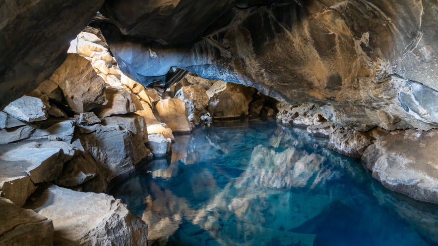 Volcanic cave Grjotagja with a incredibly blue and hot thermal water near Lake Myvatn.