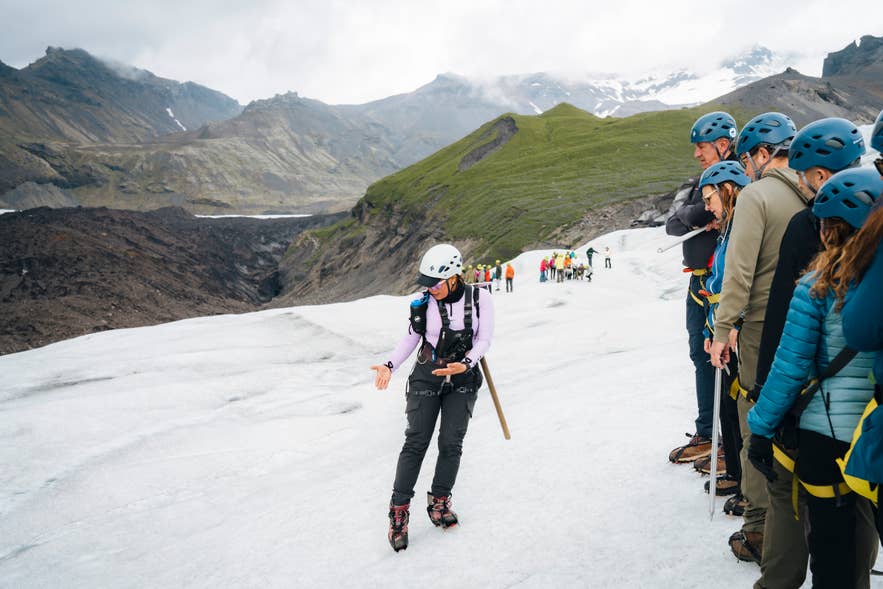 Glacier hikers walking through a crevasse labyrinth Glacier hikers walking through a crevasse labyrinth
