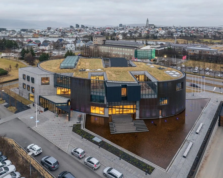 Aerial view of the World in Words building in Reykjavik with modern architecture and the city skyline in the background.
