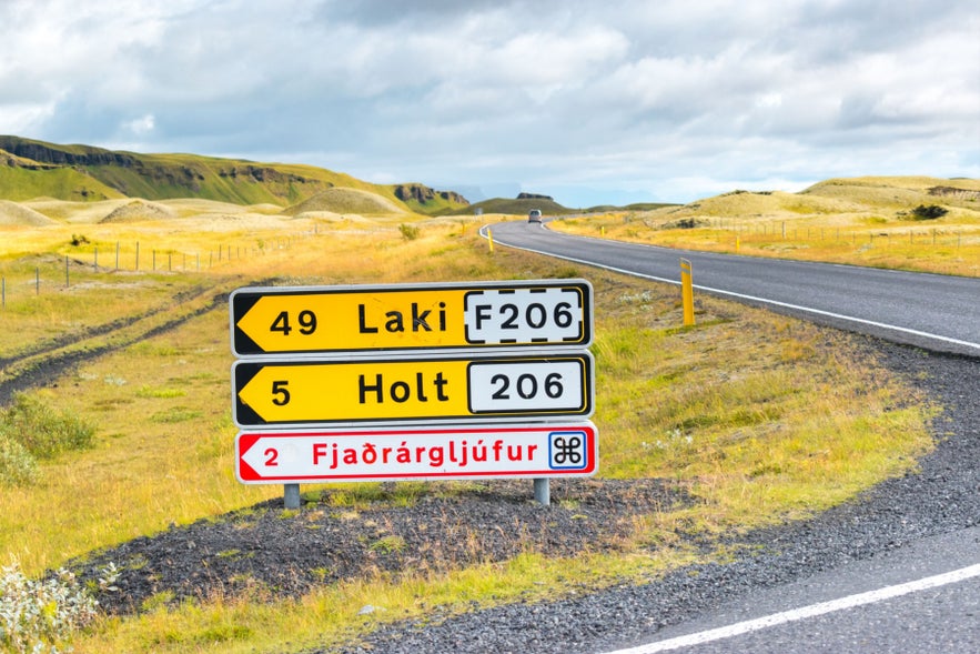 Road sign on Route 206 near Kirkjubaejarklaustur in South Iceland pointing to Fjadrargljufur Canyon and Laki Craters.
