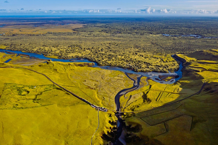 Aerial view of Fjadrargljufur Canyon near Kirkjubaejarklaustur in South Iceland, with the Fjadra River and surrounding lava fields.