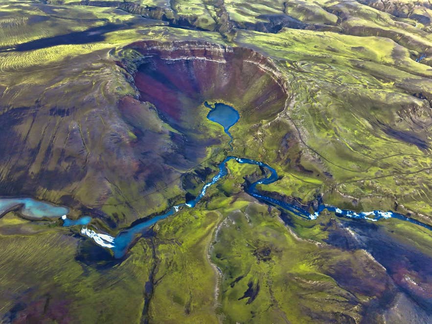 Aerial view of Raudibotn Crater on the Eldgja fissure, with turquoise river channels. Aerial view of Raudibotn Crater on the Eldgja fissure, with turquoise river channels.