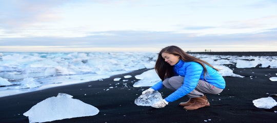 Traveler at Diamond beach in Iceland.jpeg