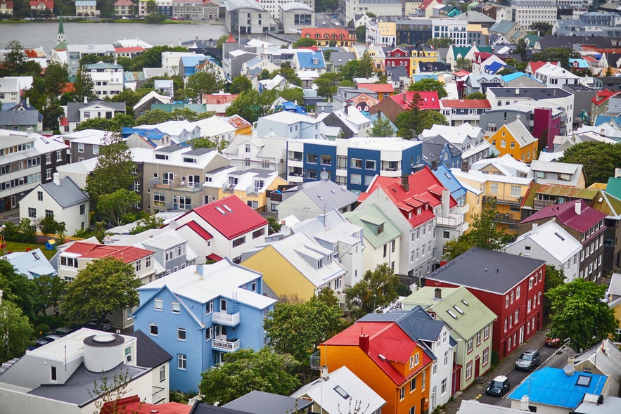 Colorful rooftops and residential houses in central Reykjavik viewed from above.