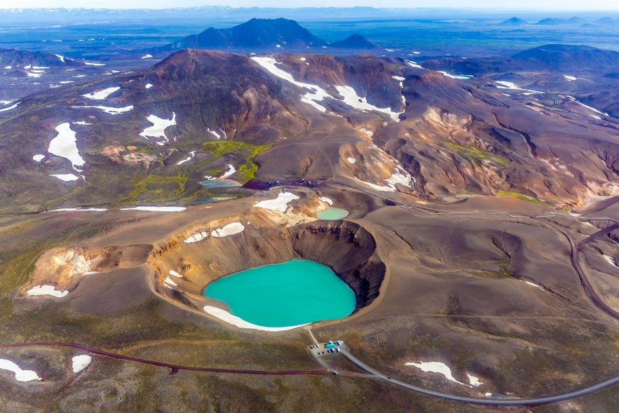 Viti crater lake within the Krafla volcanic system in North Iceland under the summer sky.
